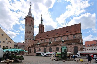 Romanesque Minster on Muensterplatz with market and market fountain in Villingen