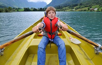 Boy in rowing boat