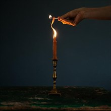 Carrot in antique candlestick with fire