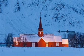 Flakstad Church at night in the snow in winter