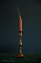 Carrot in antique candlestick