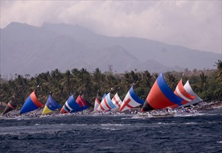 Boats with colourful sails during the Jukung Race