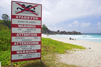 Sign with warnings in different languages about currents