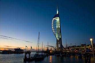 View of harbour and waterfront with Spinnaker Tower illuminated after sunset