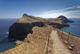 Hikers on trail at Cape Ponta de Sao Lourenco