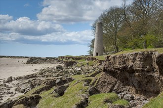 Coastal erosion near the chimney of an old ironworks near Jenny Brown's Point