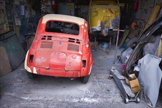 Historic old Fiat 500 in garage
