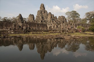 Reflection of the Khmer temple in the pond
