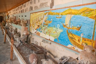 Recovered ancient amphorae and mural