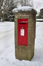 Royal Mail letterbox in the snow