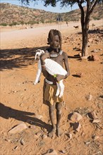 Himba child with goat