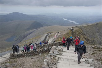 Walkers on steps near the top of the mountain