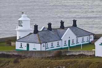 White painted lighthouse on the coast