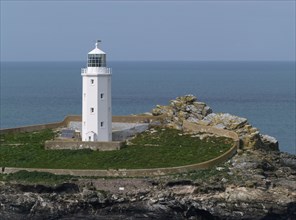 View of lighthouse on coastal island