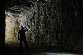 Speleologist enters abandoned cave