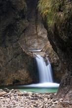 Waterfall in the Almbach river flowing through the Almbachklamm gorge in the Berchtesgaden Alps