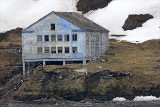 Derelict building of the abandoned Russian mining settlement in Svalbard