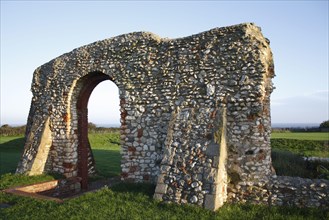 Remains of 13th Century chapel on coastal clifftop at dawn