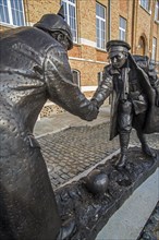 Statue by Andrew Edwards depicting British and German soldiers shaking hands during the Christmas truce in World War I in the market place of Messines