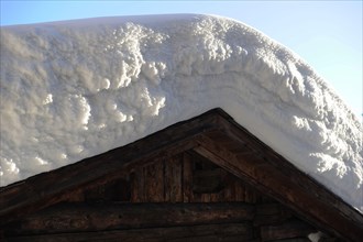 Deep snow on chalet roof