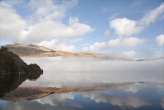 View of freshwater loch with mist