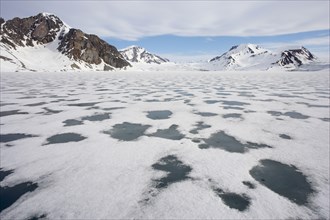 View of sea ice and snow-covered coastal mountains