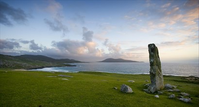 View of standing stone and coastline