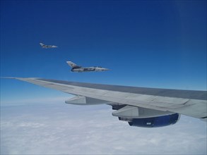 RAF Tornado fighters approaching Boeing 747s