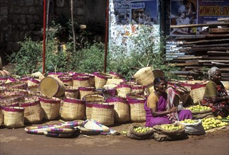 Selling palm leaf baskets in Tiruppathur near Karaikudi