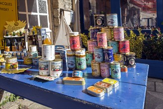 Tins of sardines and tins of crab and lobster meat outside a souvenir shop in the Ville Close in Concarneau