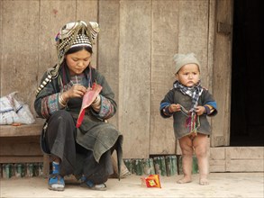 Traditionally dressed woman with child