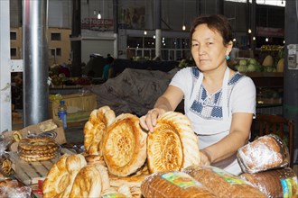 Kazakh woman selling bread