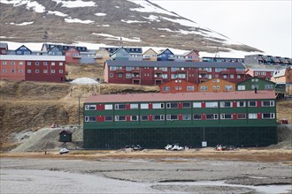Colourful wooden houses in the town of Longyearbyen in spring