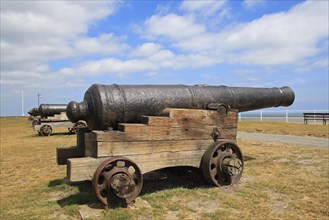 18th Century 18-pounder guns on seafront of seaside town