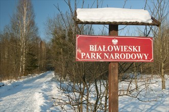 'Bialowieski Park Narodowy' entrance sign in snow