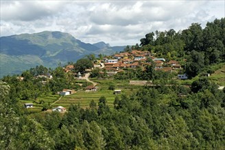 View of a hill village and terraced hillside