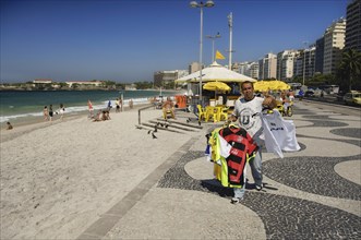 Flying traders on Copacabana beach