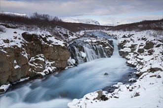 Hlauptungufoss waterfall on the Bruara River in winter