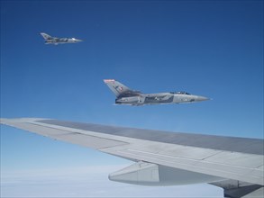 RAF Tornado fighter jets fly close to Boeing 747s