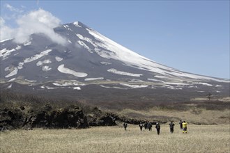 View of tourists and volcano