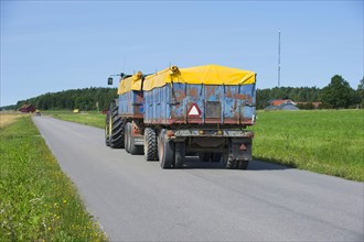 Tractor with covered trailers