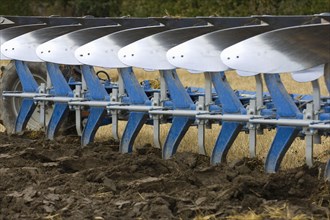 Close-up of an eight-furrow reversible plough