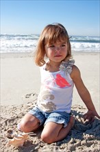 Baby girl playing at at Marine Street Beach