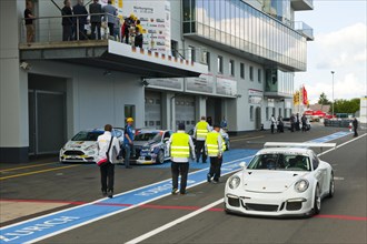 Porsche GT3 race taxi in pit lane