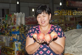 Kazakh woman at vegetable stalls