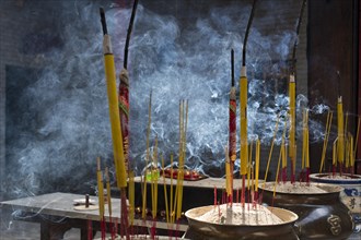 Incense sticks burning on incense pot