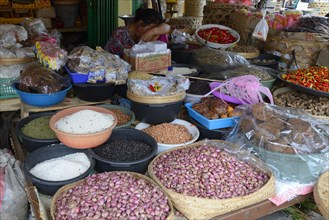 Different kinds of rice and spices at a market in Seririt