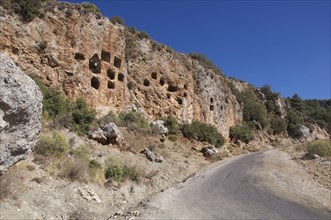 Tombs in roadside cliff