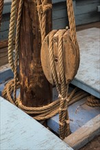 Rope in wooden pulley