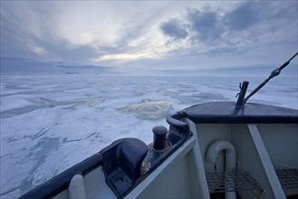 View from icebreaker over ice floes in polar night